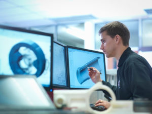 young man working with CAD programs